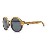 Handcrafted Polaroid Sunglasses made of wood. Round Sunglasses for men and women. Great for blocking the sun with a high fashion accessory.