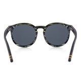Handcrafted Polaroid Sunglasses made of wood. Sunglasses for men and women. Great for blocking the sun with a high fashion accessory.