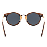 Handcrafted Polaroid Sunglasses made of wood. Round Sunglasses for men and women. Great for blocking the sun with a high fashion accessory.